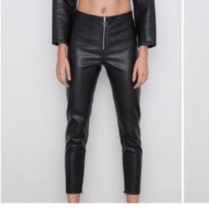 Size M Zara black faux leather leggings. Zipper front and hidden zipper at ankle